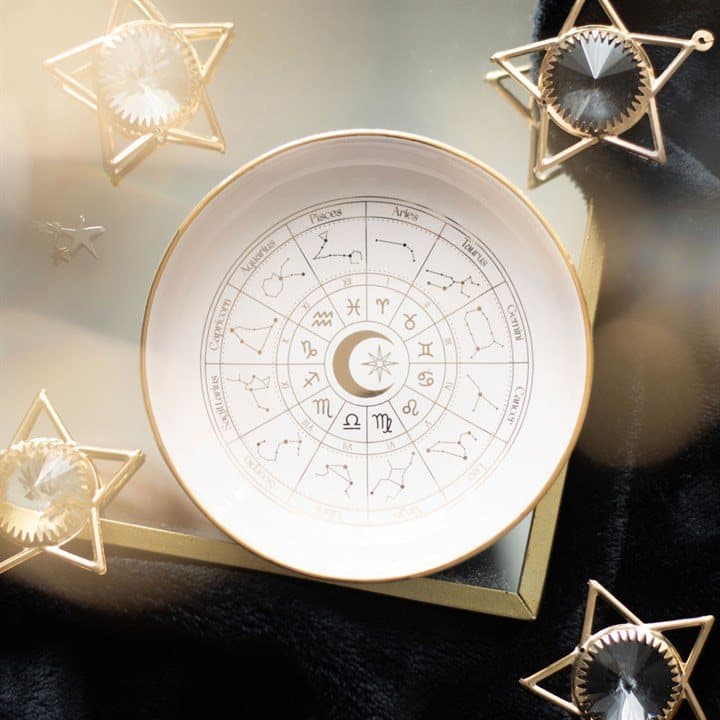 Off-white ceramic trinket dish with a gold effect astrology wheel