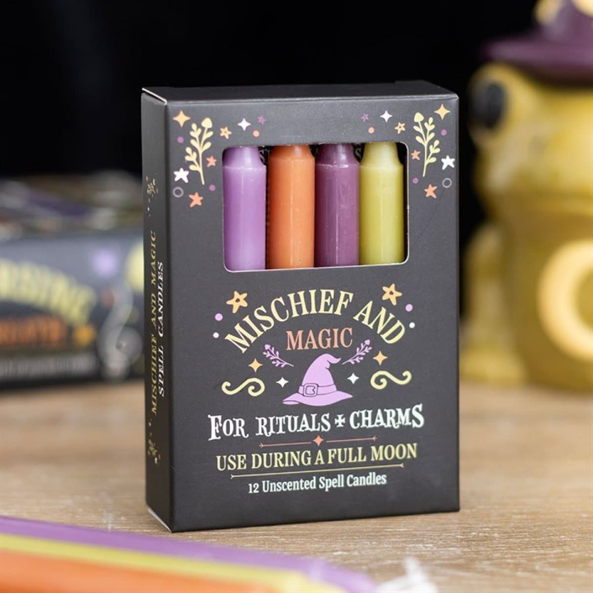 Pack of 12 Mischief and Magic spell candles in a window box