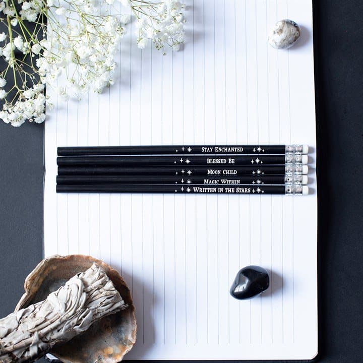 Pack of five black pencils printed with mystical phrases and stars