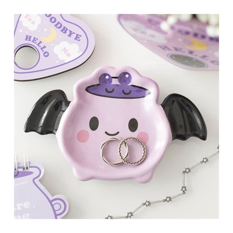 Pastel ceramic cauldron trinket dish with bat wings and a smiling face