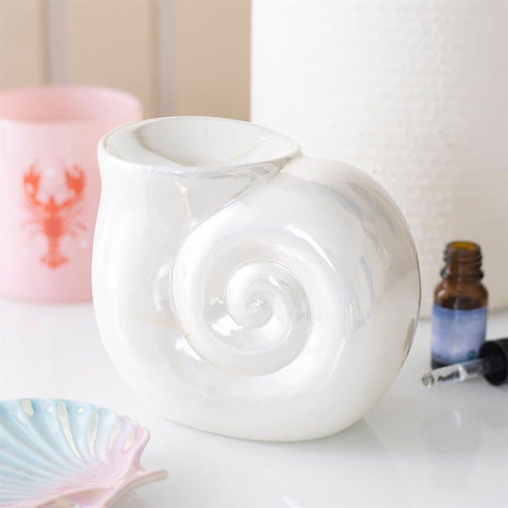 Ceramic oil burner shaped like a spiral shell with a pearlescent glaze