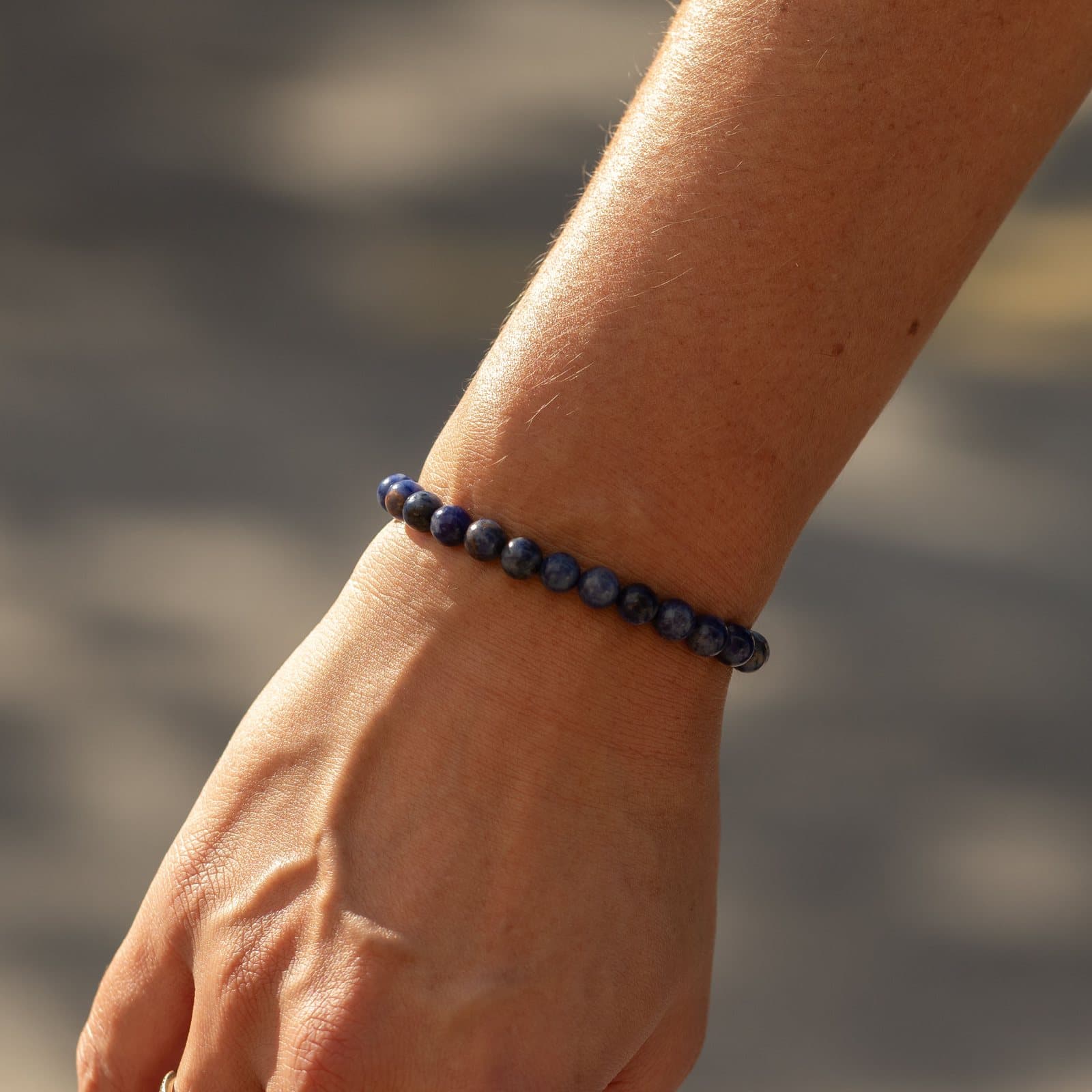 Sodalite bracelet with navy blue beads and white markings