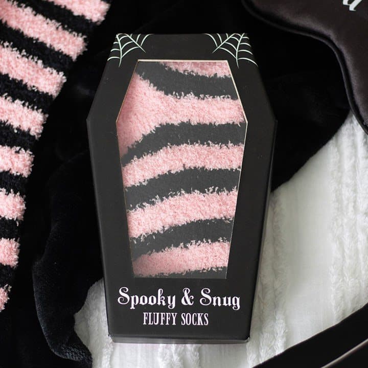 Pink and black striped socks in a coffin-shaped box with a window