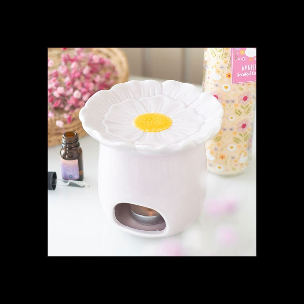 Pink ceramic oil burner shaped like a daisy