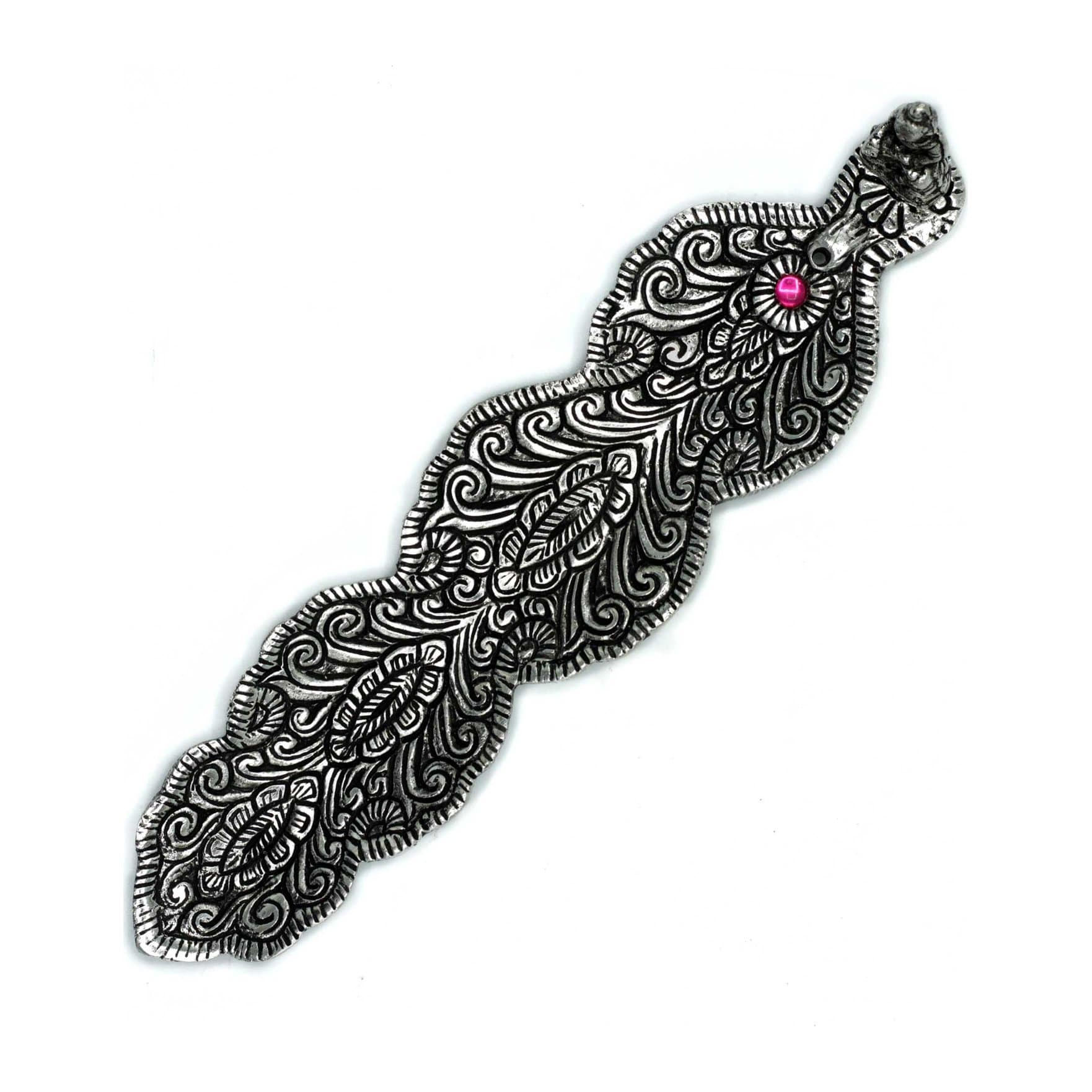 Polished aluminium feather incense holder with a small Buddha figurine on the tip