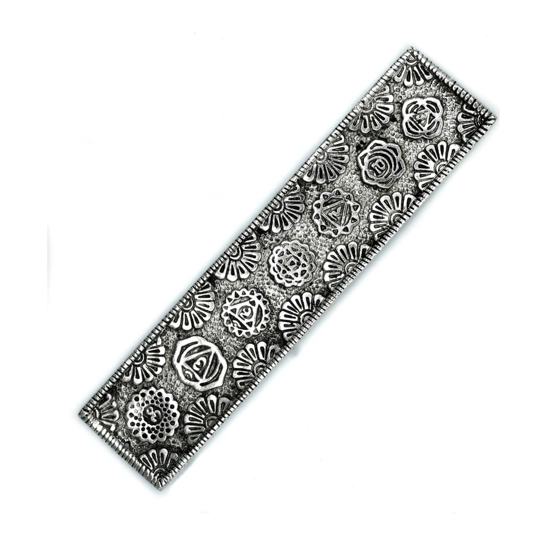 Long polished aluminium incense holder with a floral seven chakra design