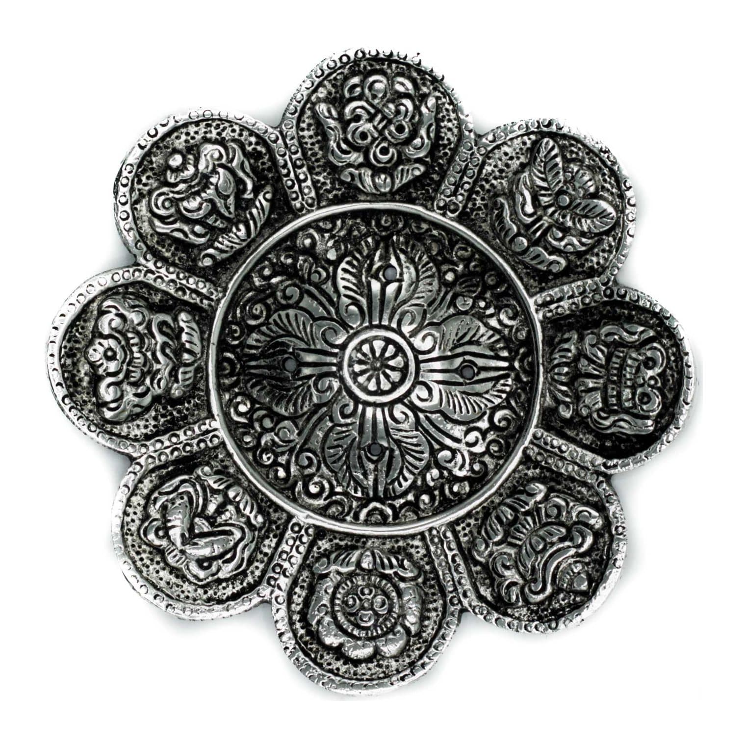 Polished aluminium incense holder with Tibetan symbols