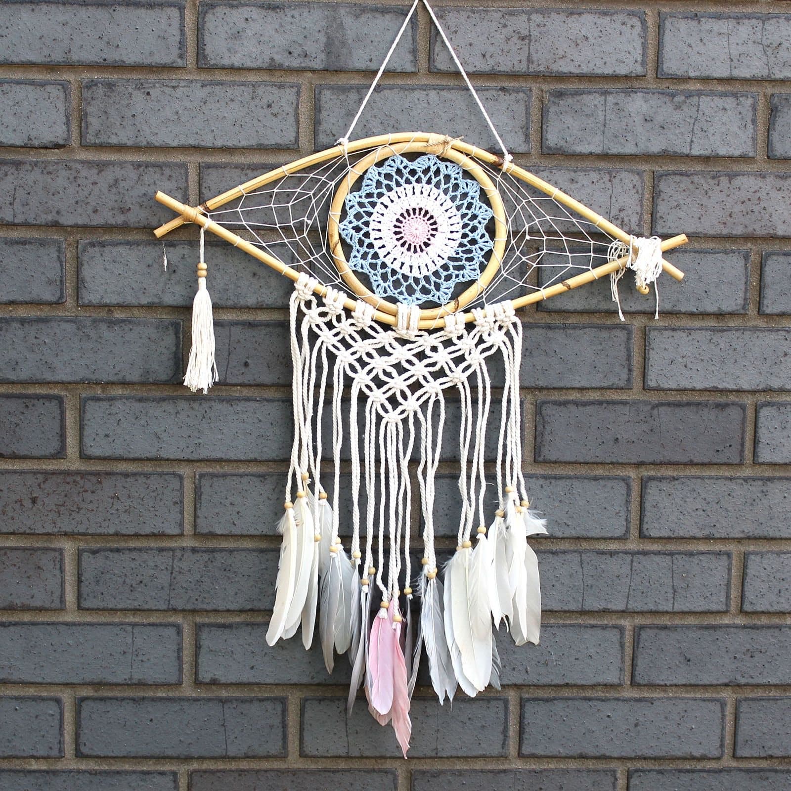 Macrame dream catcher with Evil Eye, rattan frame and hanging feathers