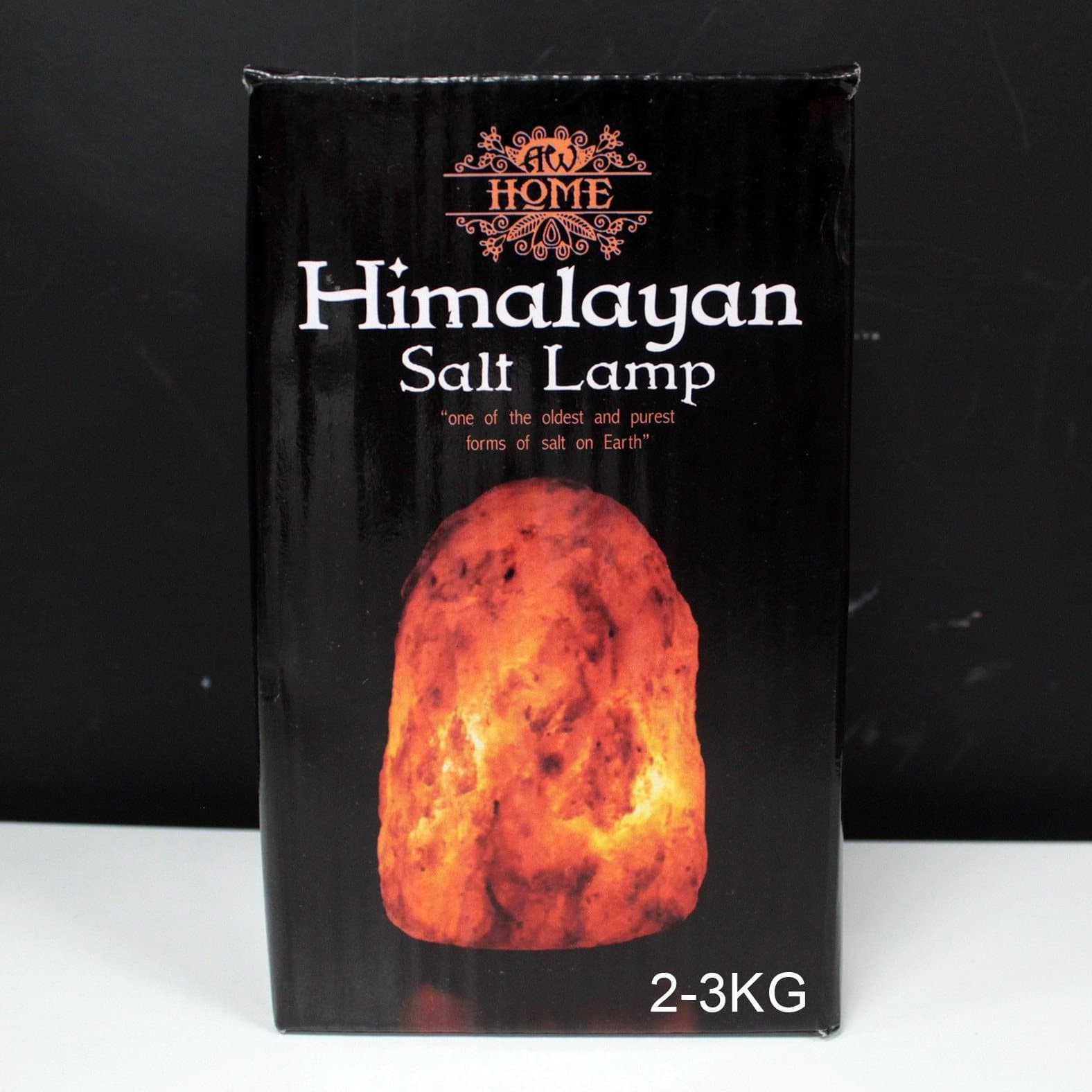 Natural Himalayan salt lamp on its base