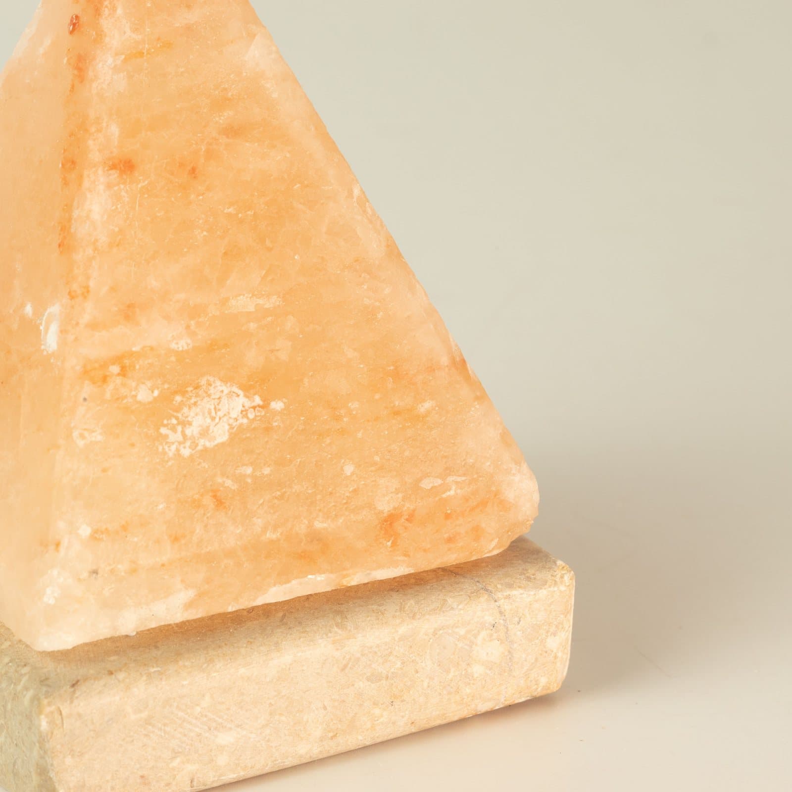 Pyramid-shaped Himalayan salt lamp with USB connector