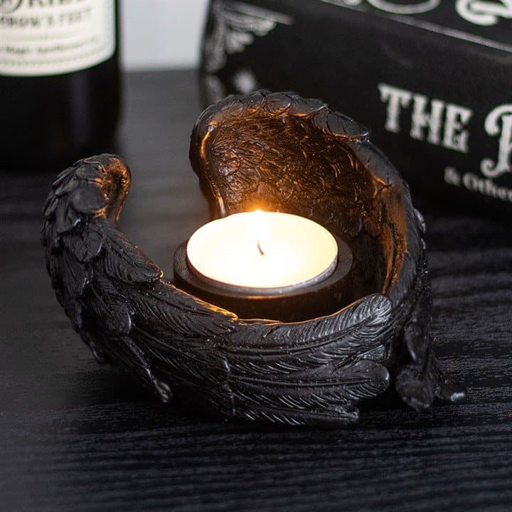 Resin tealight candle holder shaped like raven wings
