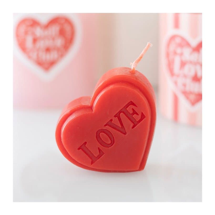 Red heart shaped Valentine's Day candle