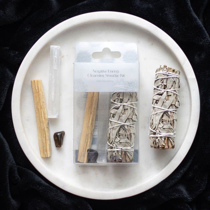 Picture box with window holding white sage, Palo Santo, selenite wand and hematite