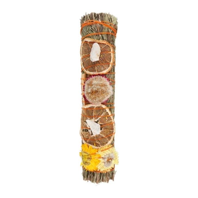 Hand-tied bundle of rosemary, palo santo and dried flowers with a raw quartz crystal