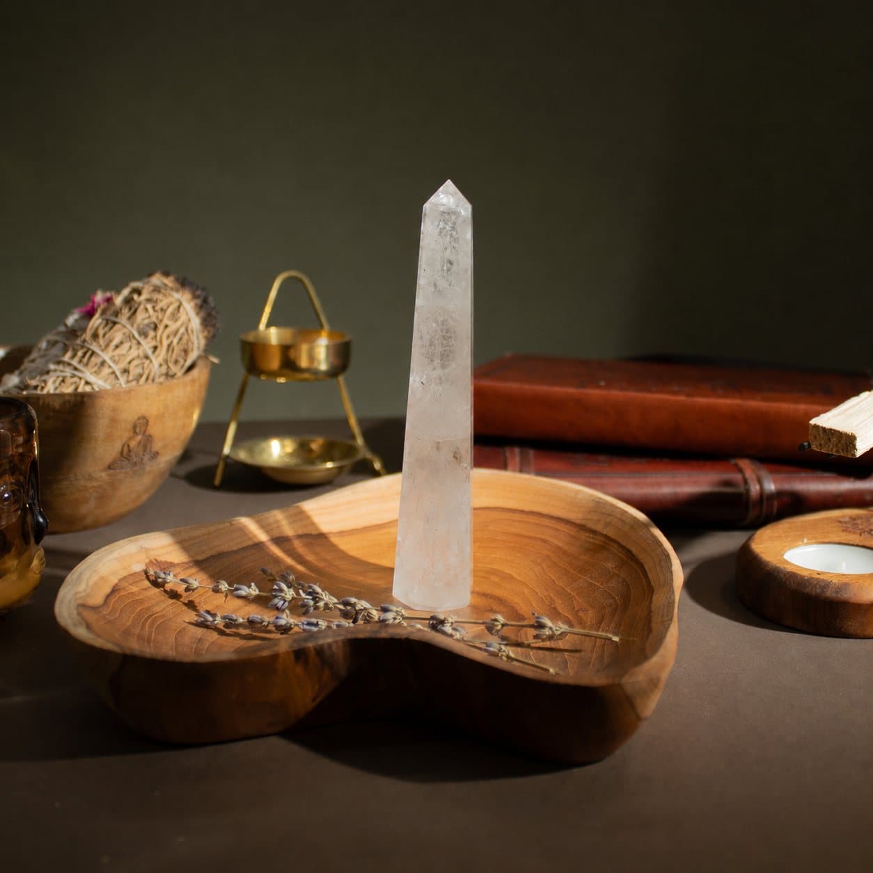 Polished clear rock crystal obelisk point with six faces