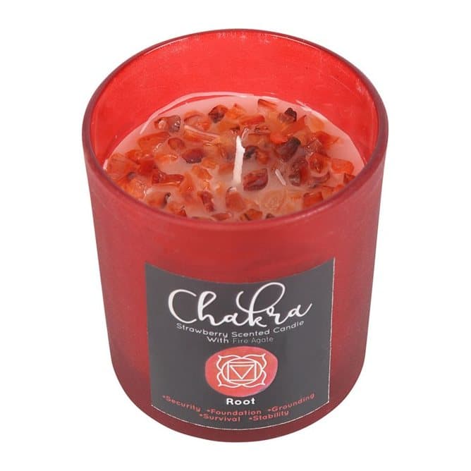 Red frosted glass candle with metallic lid and fire agate crystal chips