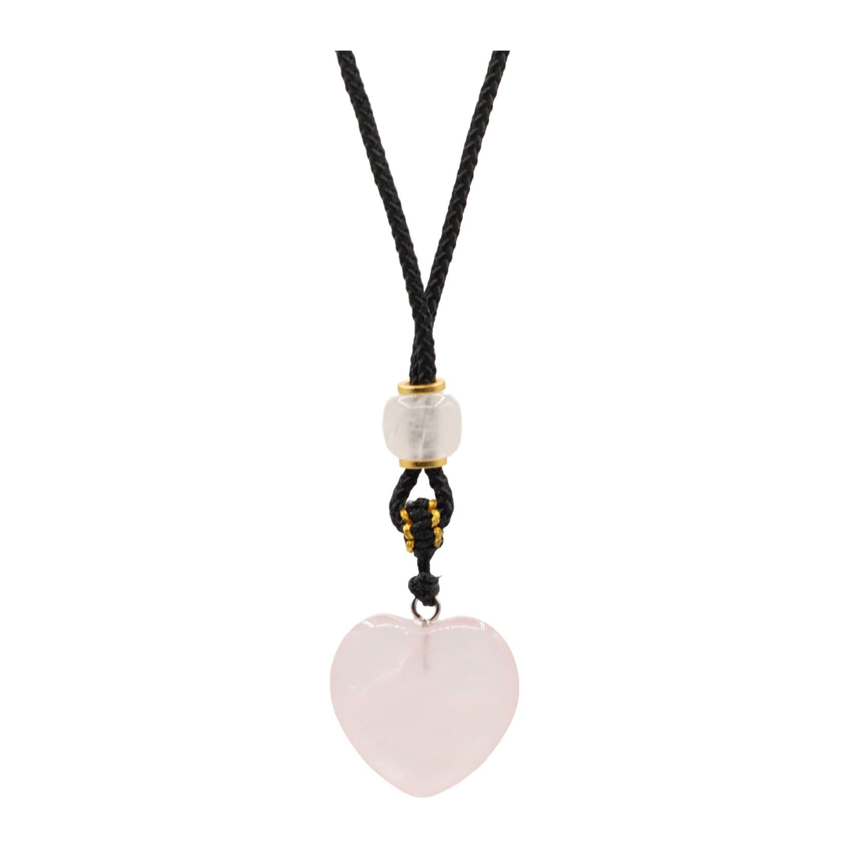 Rose quartz heart pendant hanging from an adjustable cord