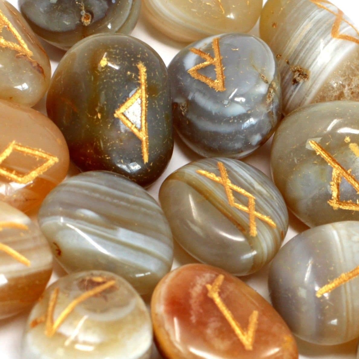 Set of banded agate rune stones with a printed cotton pouch
