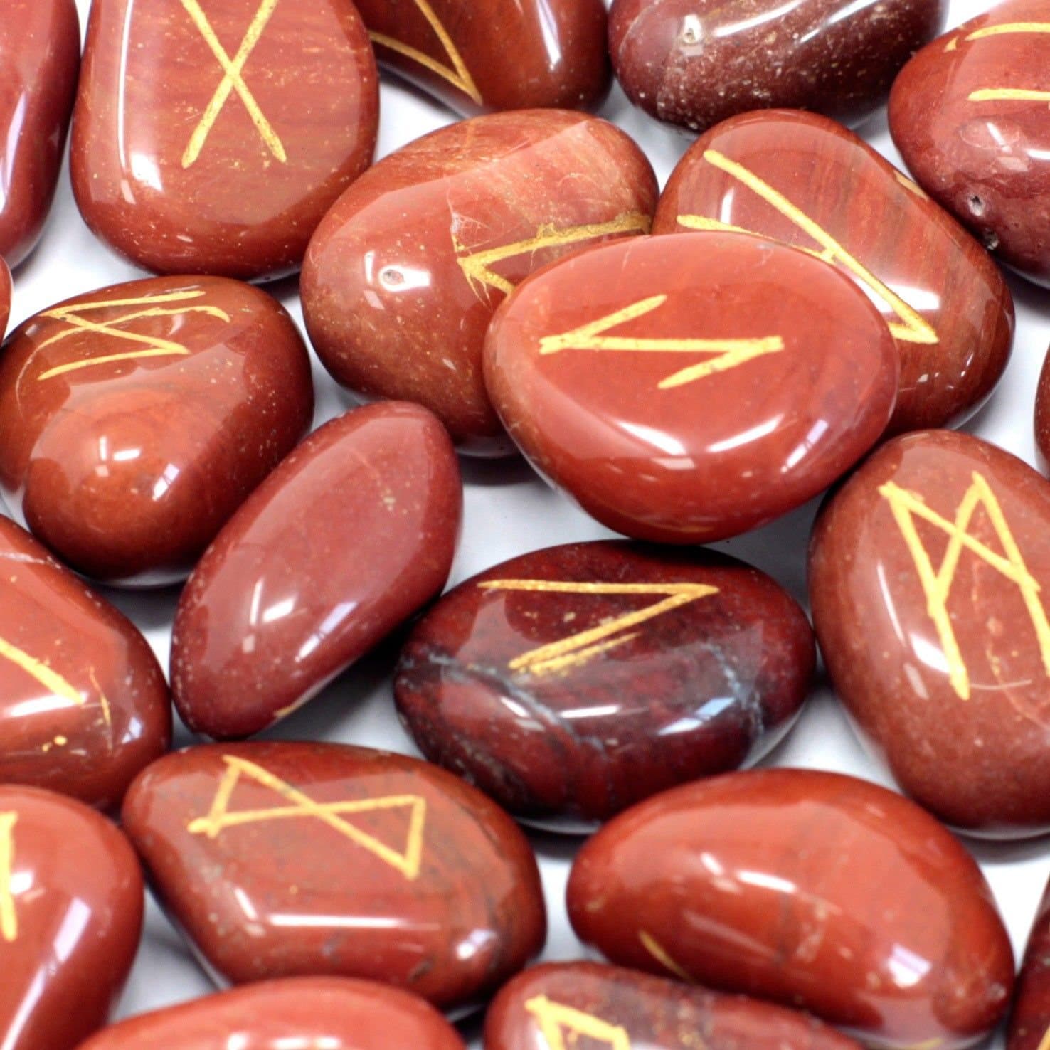 Red jasper rune stones with a printed cotton pouch