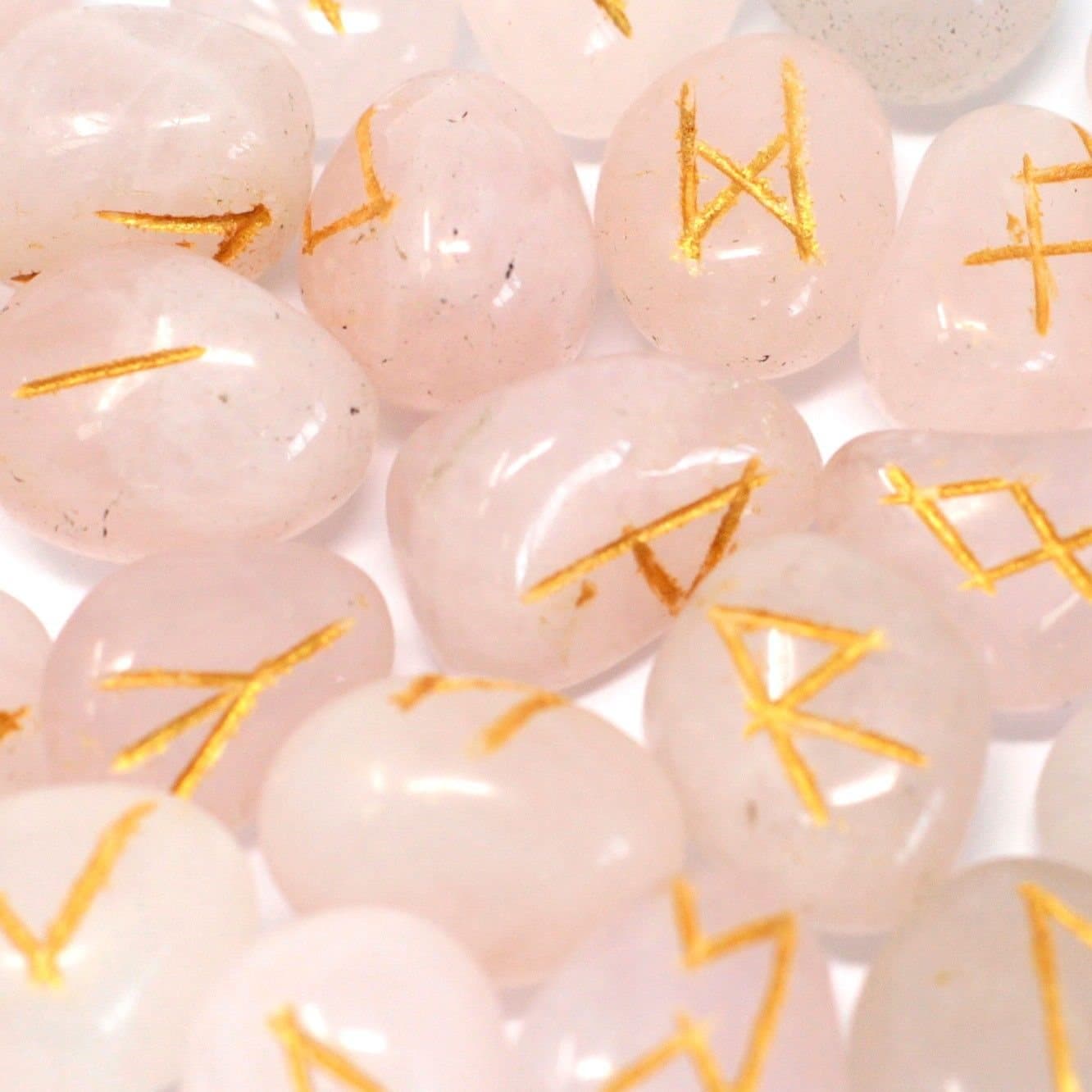 Set of rose quartz rune stones with a pouch