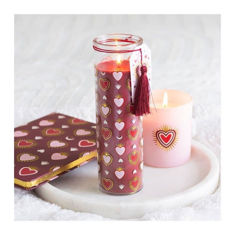 Tall glass black fig tube candle with a sacred heart design and metallic accents