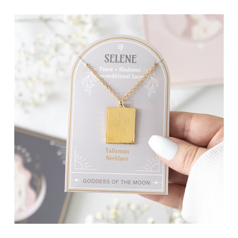 Gold-toned Selene goddess pendant necklace on a matching backing card