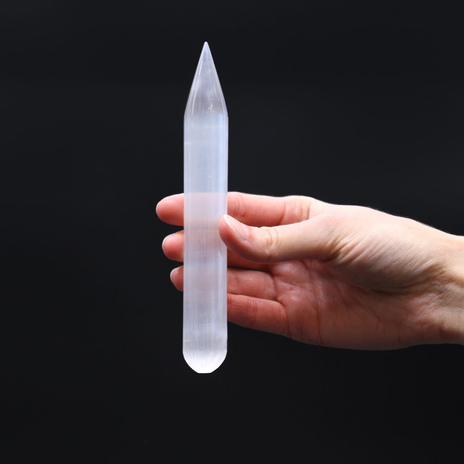Milky white selenite wand, 16 cm long, with a point at one end