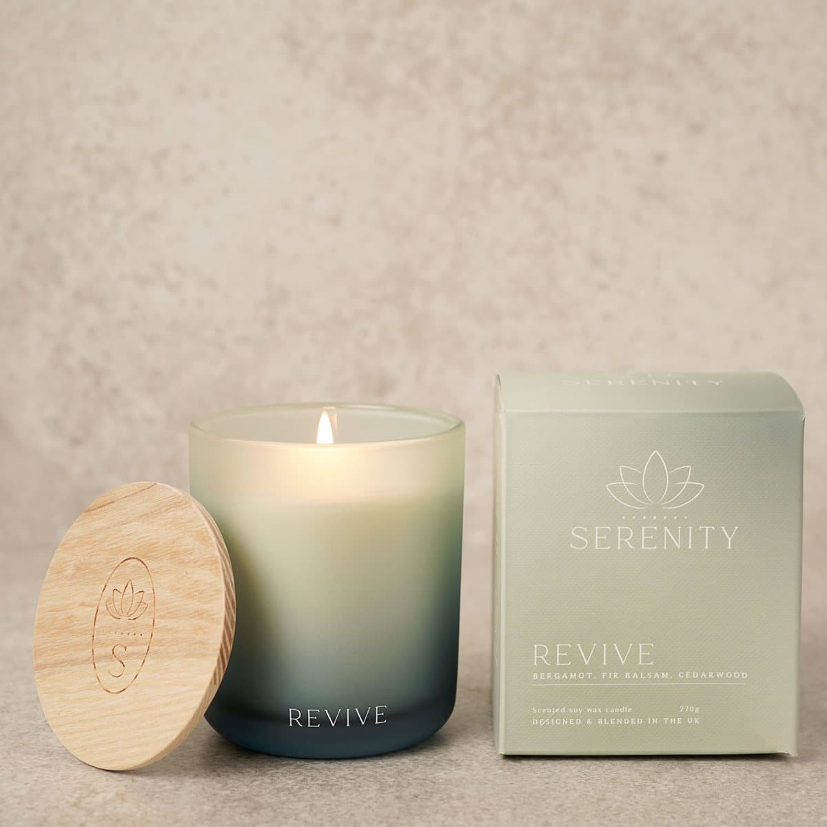 Blue ombre scented candle with a wooden lid and a gift box