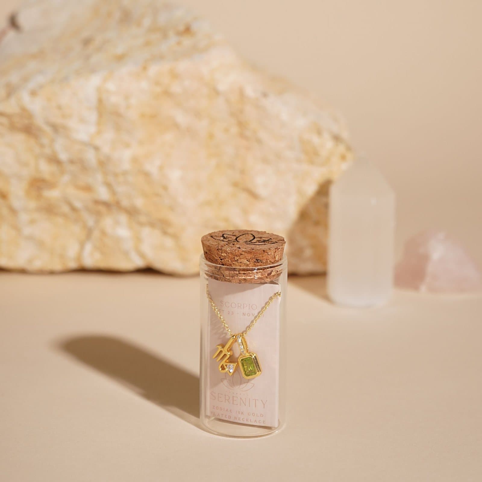 Scorpio zodiac necklace with gold-plated charm in a cork-topped glass vial