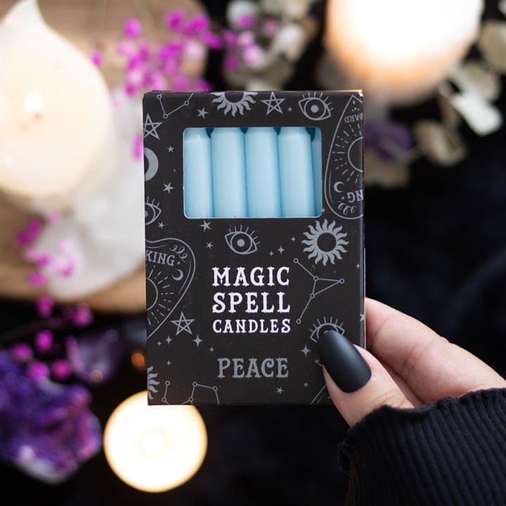 Pack of 12 light blue spell candles in a picture box with window