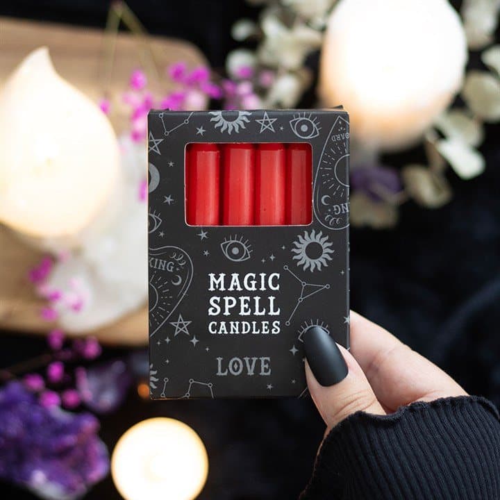 Pack of 12 red spell candles in a picture box with a window