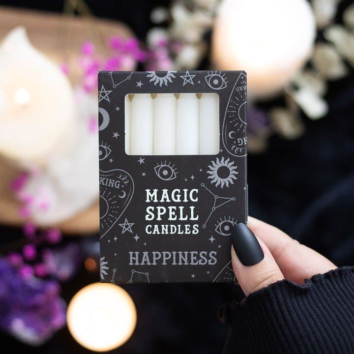 Box of 12 white spell candles in a picture box with a window