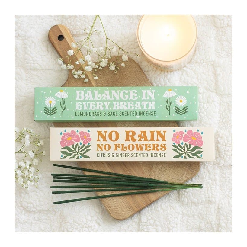 Colour cardboard box with window holding two packs of incense sticks