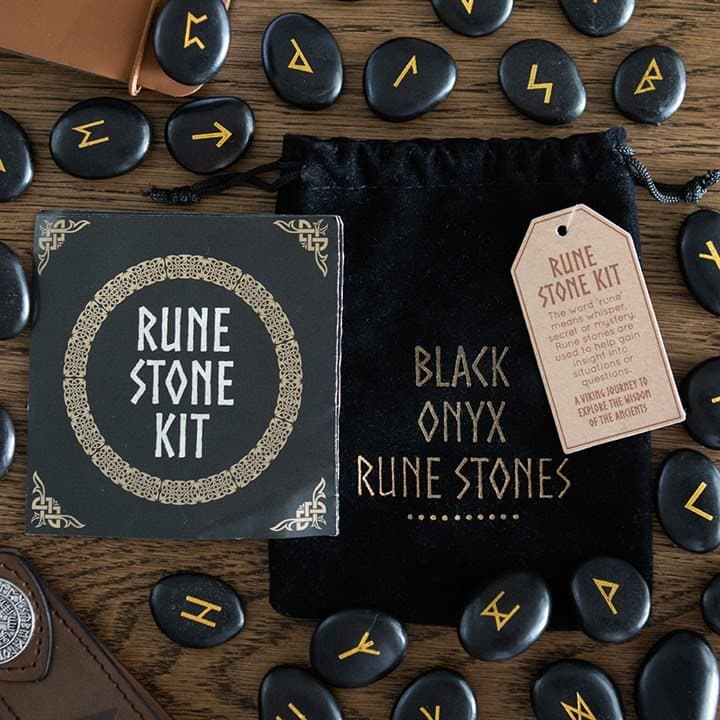 Set of polished black onyx rune stones with a drawstring pouch