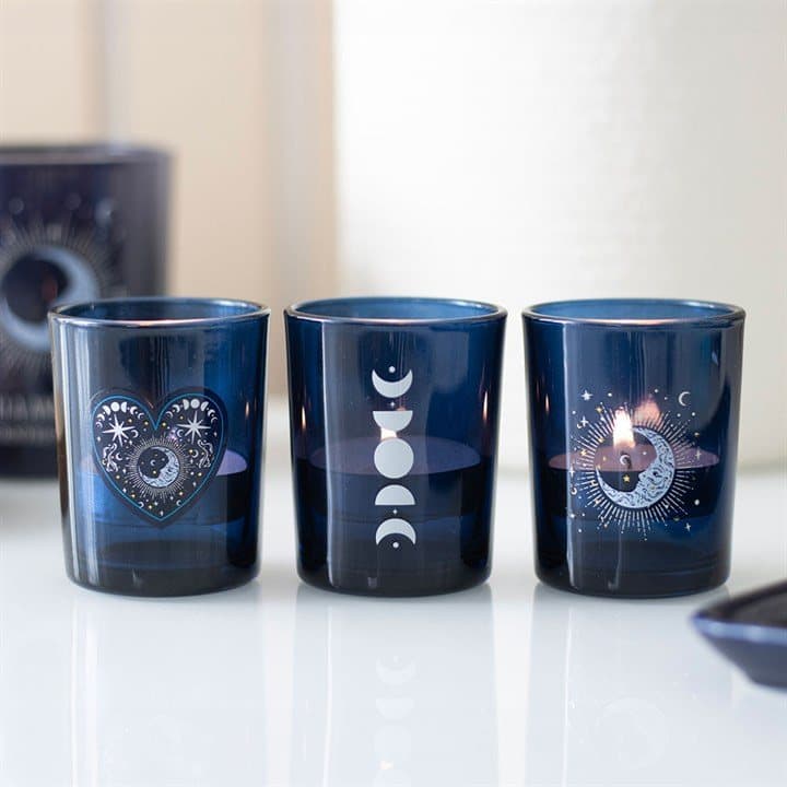 Set of three glass moon-themed votive candle holders