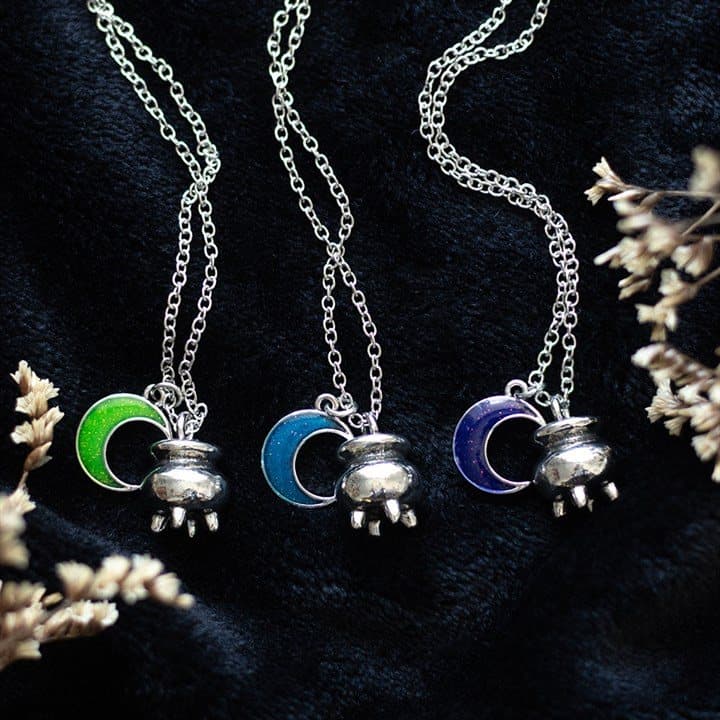 Three cauldron charm necklaces with blue, purple and green crescent moons
