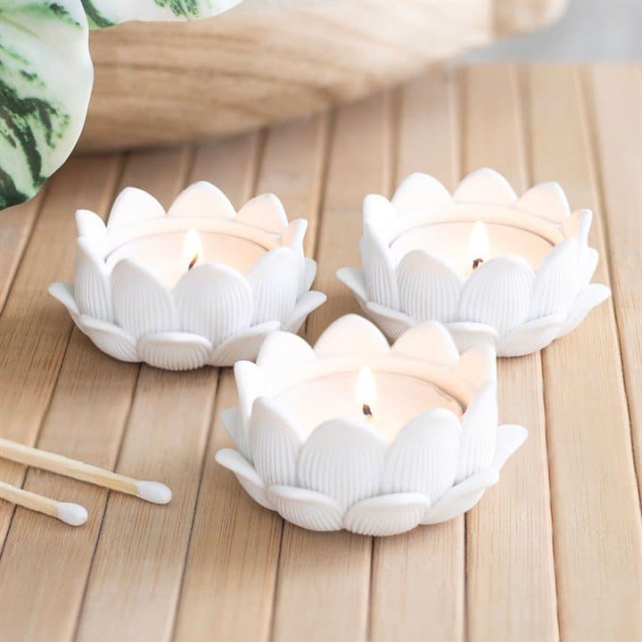 Set of three white lotus flower tealight holders