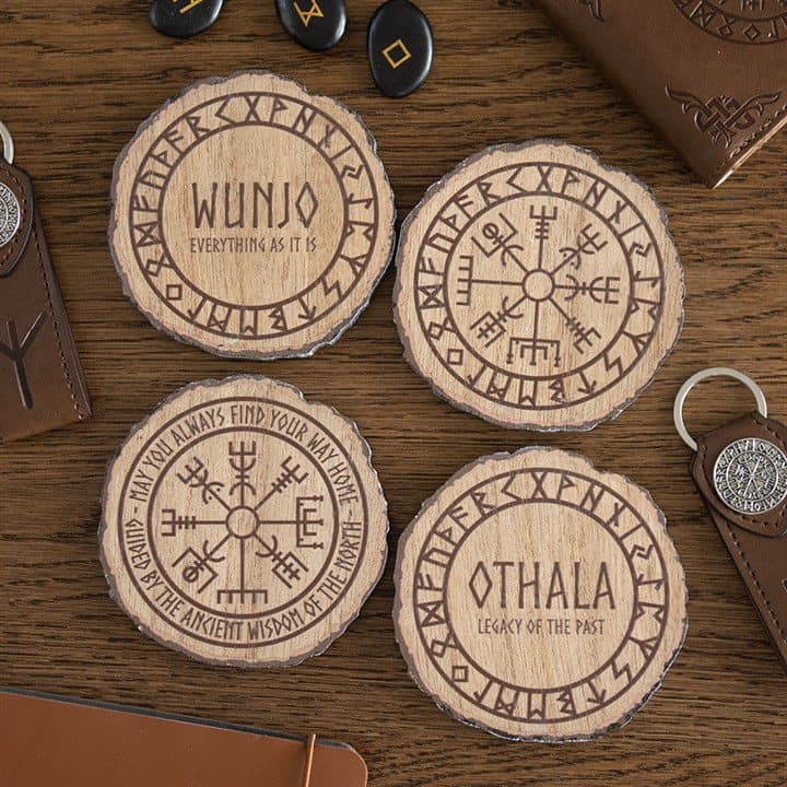 Set of four wood slice coasters with Viking-inspired runes and symbols