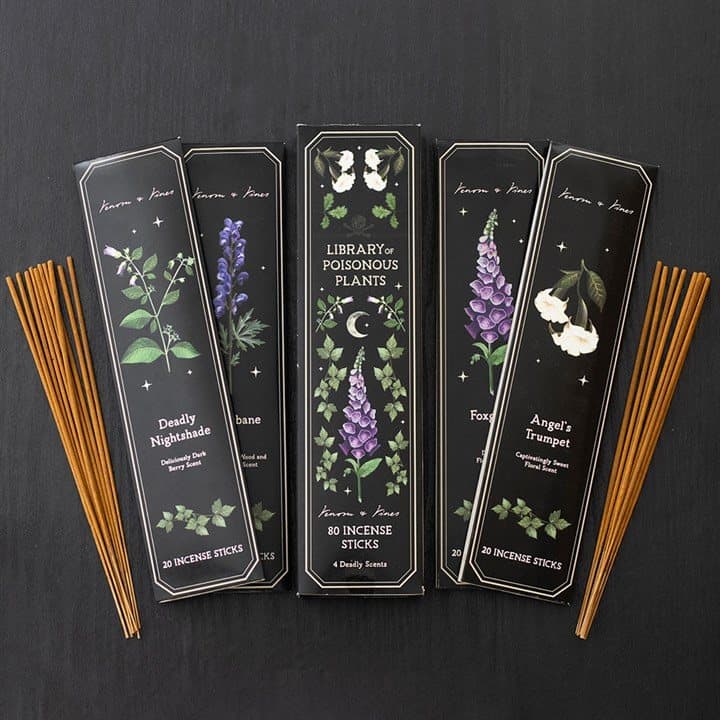 Four incense stick packs with poisonous plant designs beside a colour box