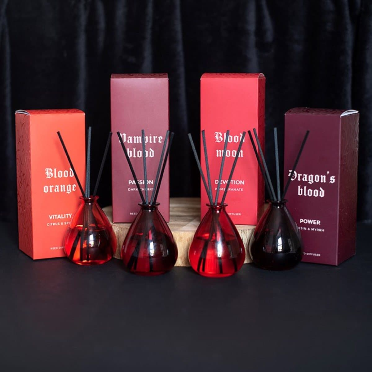 Set of four glass reed diffusers in a colour cardboard box