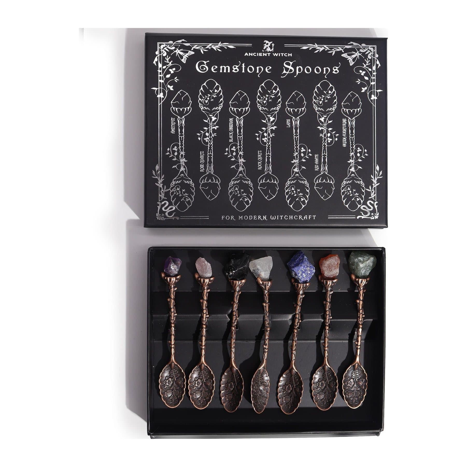 Set of seven bronze witch spoons with gemstones