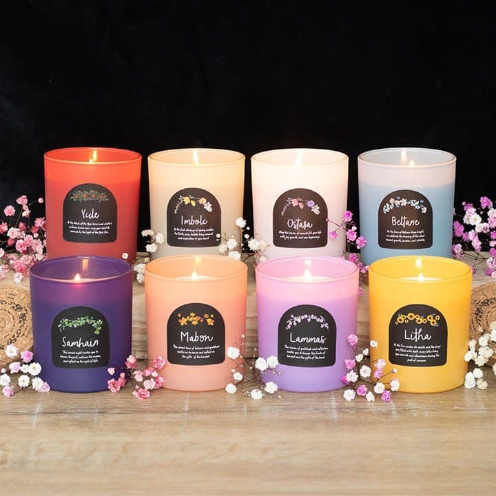Set of eight Wheel of the Year candles in glass jars with cork lids