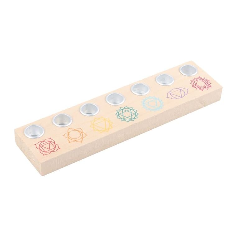 Light wood candle holder for seven taper candles in the chakra colours