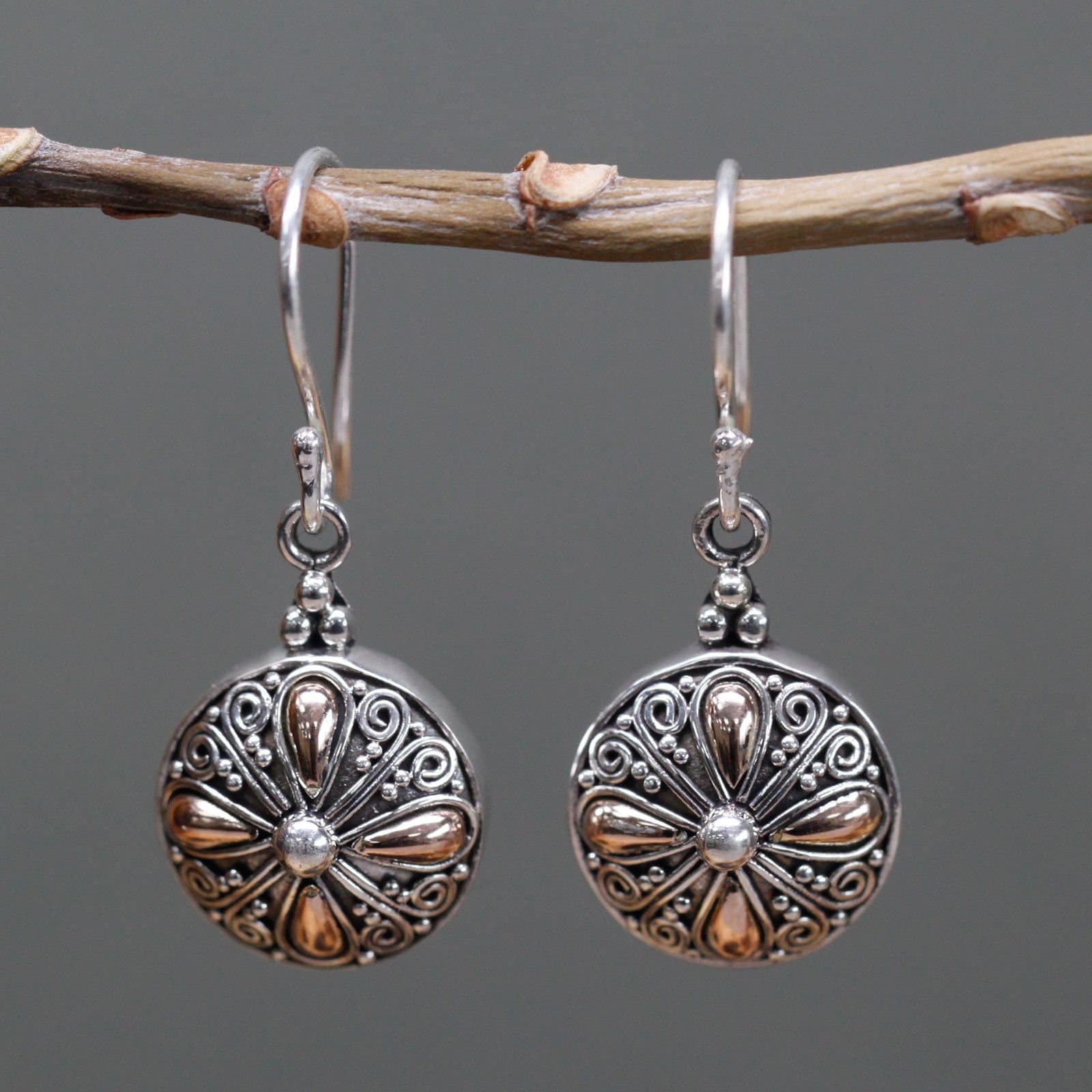 Classic round silver and gold earrings with a hook fitting
