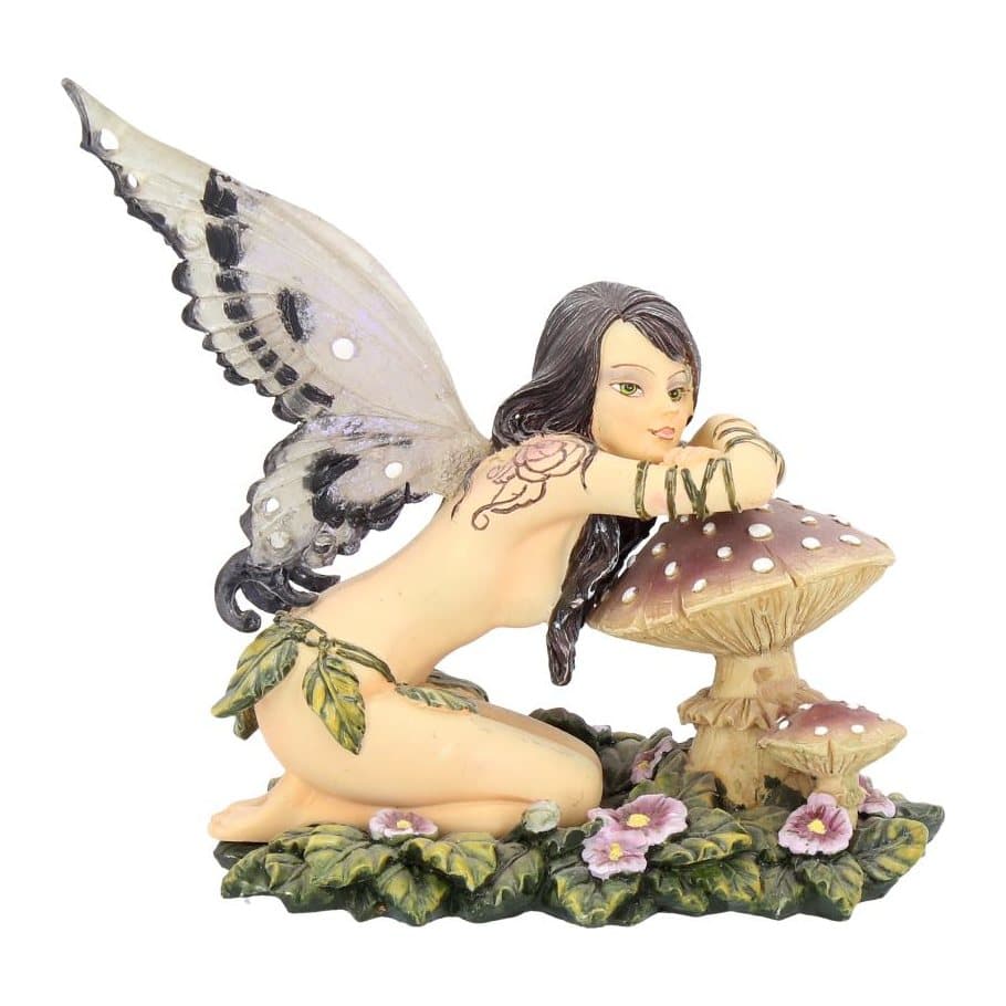Serena fairy figurine kneeling by a red toadstool with amethyst-coloured wings