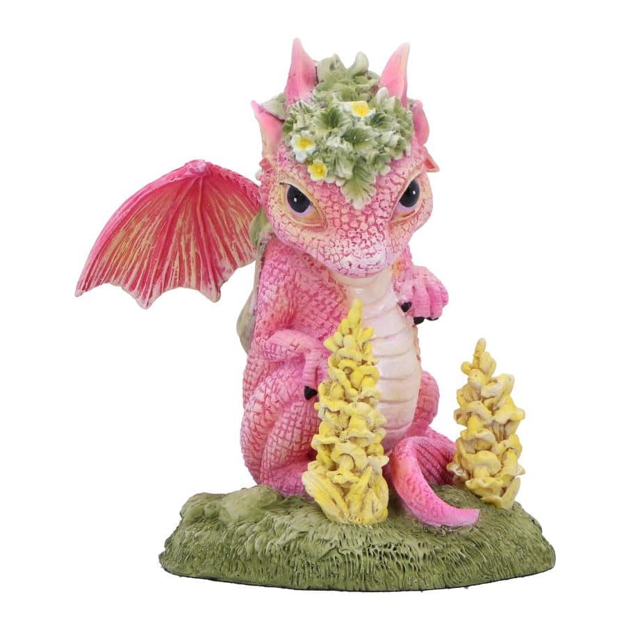 Pink baby dragon figurine with flower crown on a green base