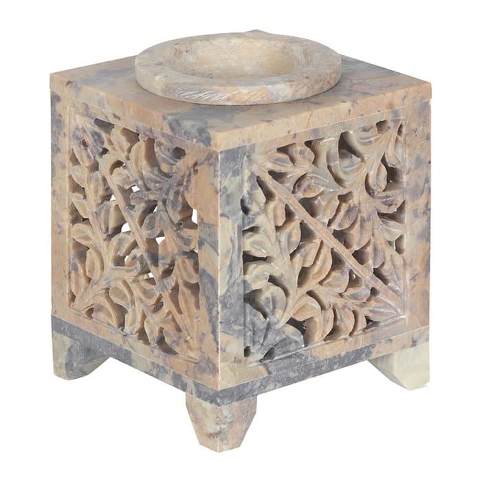 Soapstone oil burner with leafy cutouts and a Moroccan arch opening