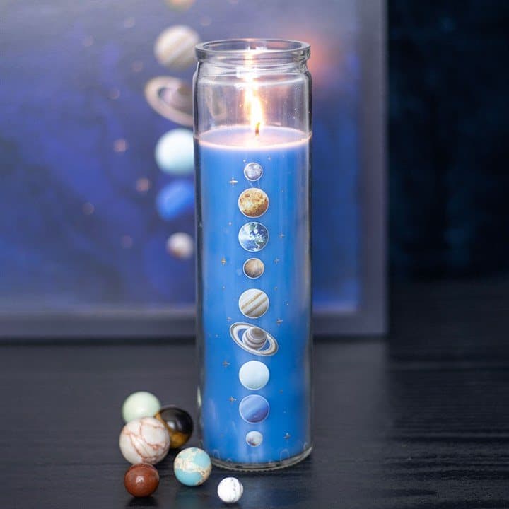 Tube candle with a celestial solar system design