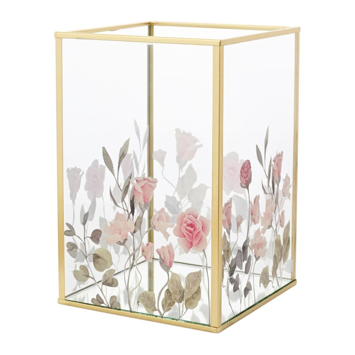 Glass tea light holder with a floral motif