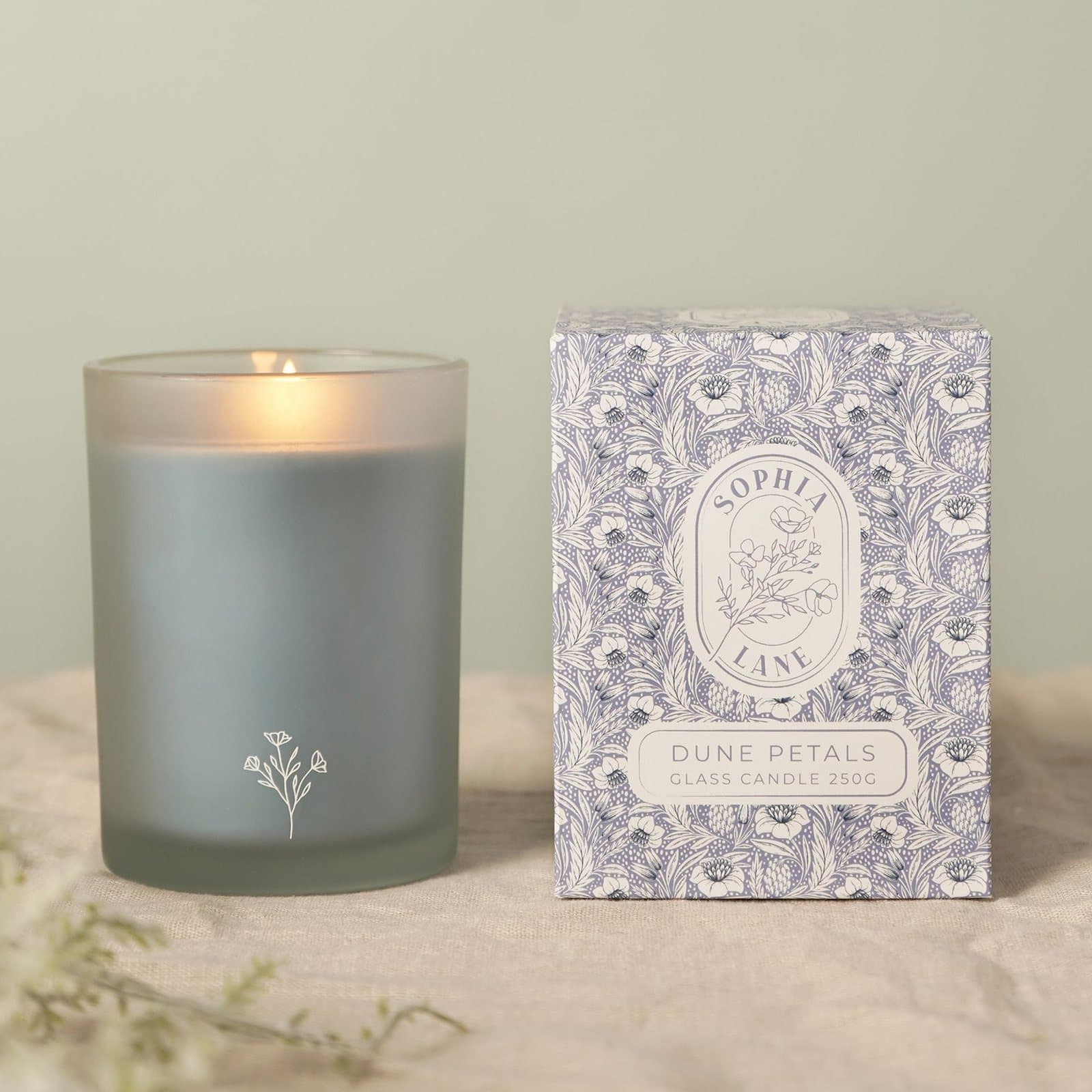 Sophia Lane Dune Petals floral candle in a glass container with floral gift box